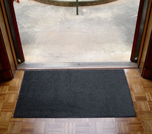 black entry mat on floor